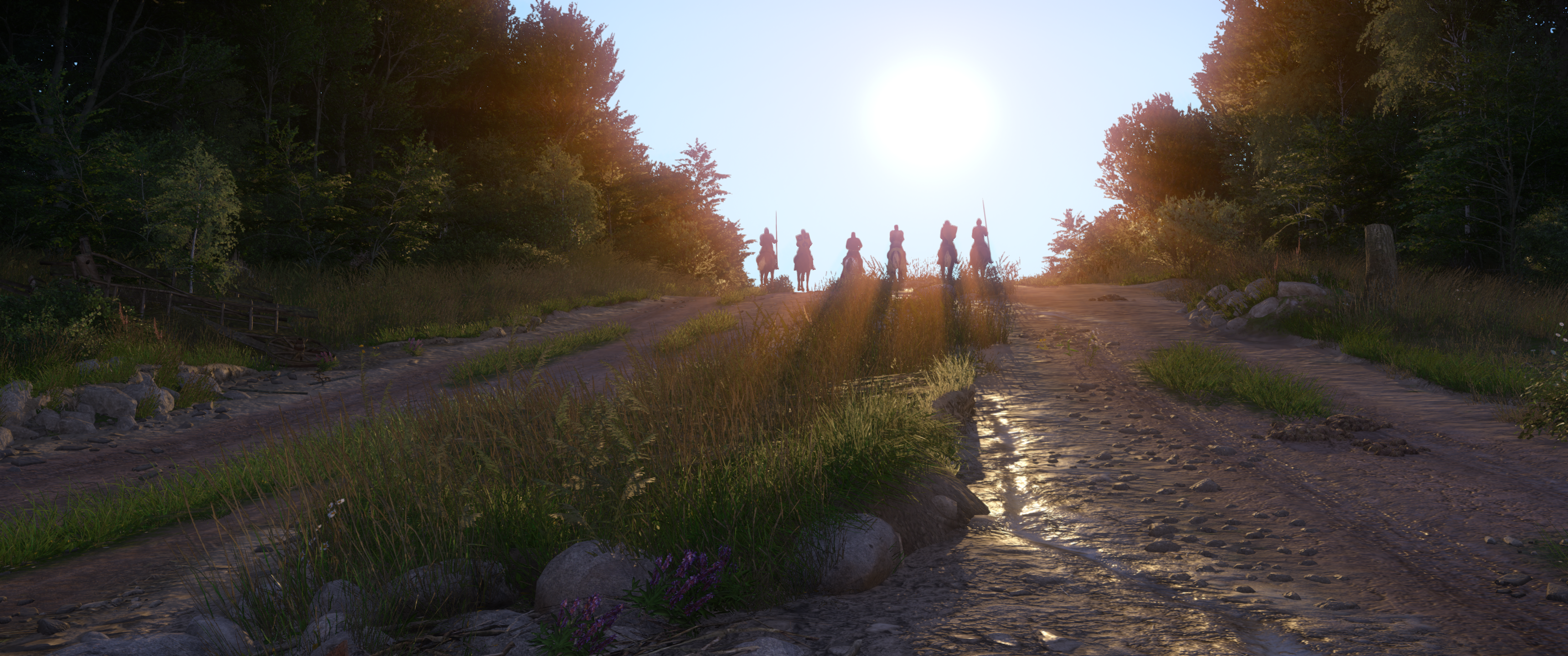 Zrzut ekranu z gry Kingdom Come: Deliverance, Henry i Hans wraz z towarzyszami wyruszają w stronę zamku Trosky